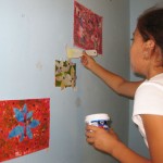 September Featured Artist Angela installs her art for her show titled "Weeds"