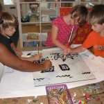 Youth artists participate in a Mono-Print workshop