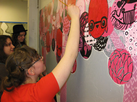 Monica, Claire and Teagan putting the finishing touches on our mural.