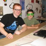 Youth art Mentor Kevin Christensen with youth artist Roan wearing his rad glasses! May 2011