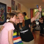 Teen artist Mitzy taking a picture with friends at the "Robots!" show May 2010