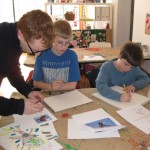 Youth Art mentor Kevin Christensen working with Matthew and Adam in the Illustration Gallery Class 2010