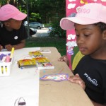 Kayla and Kai participate in our Think Art! Mural and Installation at A Day in Our Village 2011