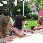 Molly and friends participating in out Think Art! mural and Installation at A Day in Our Village 2011