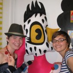 Monica and Teagan take a picture with Mindy Fisher's "Chicken Lady" during "The Candy Store" Pop-Up Gallery show