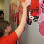 Monica, Claire and Teagan work on the "Now You See It" Mural at the Flat Iron Building in Wicker Park 2011